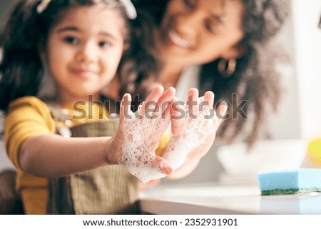 Soap, cleaning hands and family with child in bathroom for learning healthy hygiene routine at home. Closeup, mom and girl kid washing palm with foam for safety of bacteria, dirt or germs on skincare Royalty-Free Stock Photo #2352931901