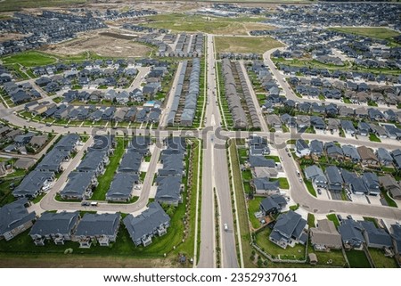 Elevated view of Rosewood neighborhood in Saskatoon, presenting a tapestry of urban design intertwined with Saskatchewan's serene natural canvas.