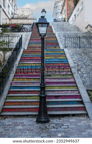 Colorful steps from a street in Montmartre leading up to the Basilica of the Sacred Heart of Paris.