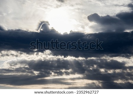 Sunrays showing through dark clouds