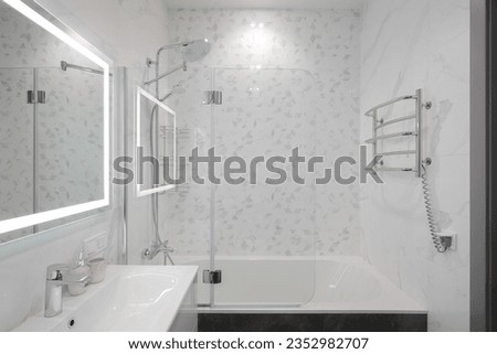 Shower over the bath in the the bathroom interior Royalty-Free Stock Photo #2352982707