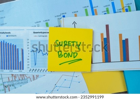 Concept of Surety Bond write on sticky notes isolated on Wooden Table. Royalty-Free Stock Photo #2352991199