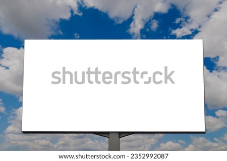 Mock up: blank white billboard or large display against the blue sky with white clouds. Copy space, advertising, mockup, white screen, cloudscape and template concept