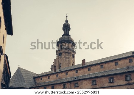 Dome of the church with a cross. City Lviv. Flag of Ukraine. High quality photo