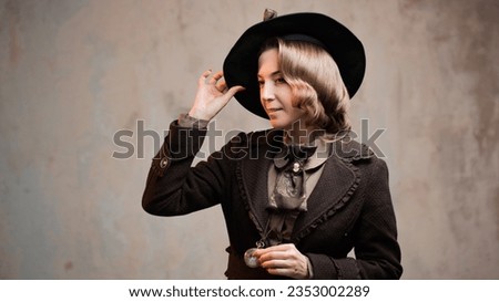 Stylish lady in an elegant suit in Victorian style, in a hat, close-up portrait Royalty-Free Stock Photo #2353002289