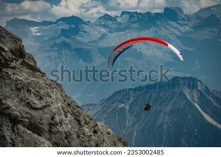 Tandem Paragliding in the terrific alpine landscape of Mount Pilatus, Switzerland. Royalty-Free Stock Photo #2353002485
