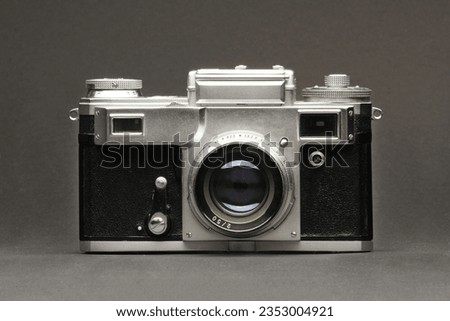Antique camera on a grey background