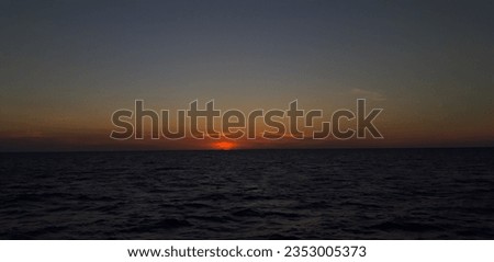 after sunset in the middle of ocean
