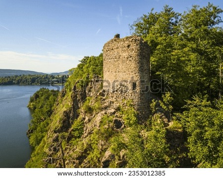 Aerial view of castle ruins Oheb. Romantic medieval ruins over lake Sec. Czech republic, European union.