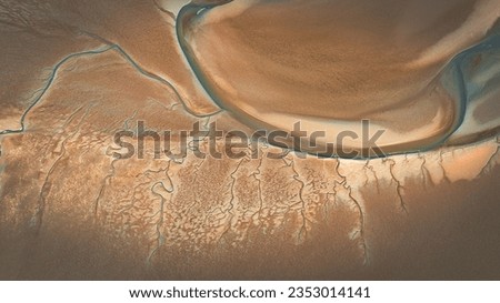 Aerial view of low tide with visible river bed by the beach Llanfairfechan, North Wales, Cymru, UK