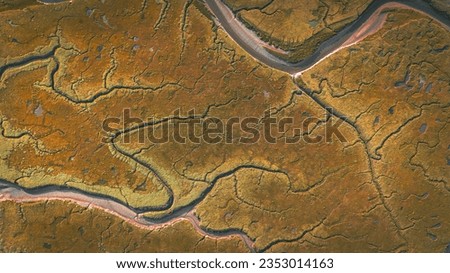 Aerial view of low tide with visible river bed by the beach Llanfairfechan, North Wales, Cymru, UK Royalty-Free Stock Photo #2353014163