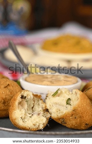 Fried codfish fritter typical Portuguese and Brazilian cuisine fish with herbs food delicios