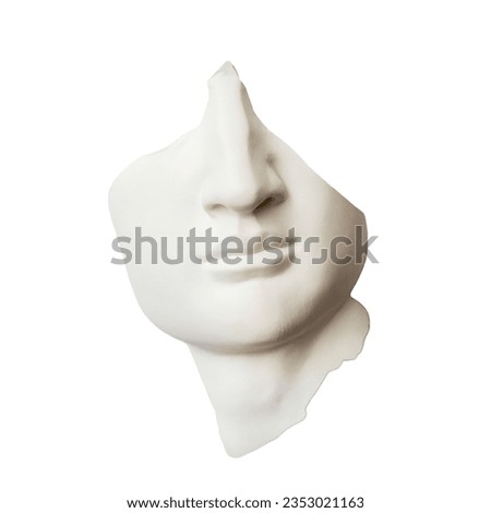A piece from a broken plaster head - the lower part of the face with a Greek, antique nose and mouth. Royalty-Free Stock Photo #2353021163
