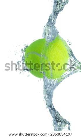 Tennis Ball falls into water and creates air bubbles on surface. Tennis green Ball drop hit smash to clear water and deep to bubble. White background isolated freeze motion Royalty-Free Stock Photo #2353034197