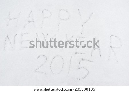 inscription heppy new year 2015 on snow-covered ice, the inscription on the snow