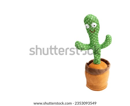 Dancing cactus children's toy with table back and music isolated on a white background with copy space.