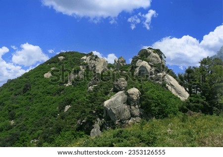 Beautiful rocks and cliff ridges in Korean mountains Royalty-Free Stock Photo #2353126555