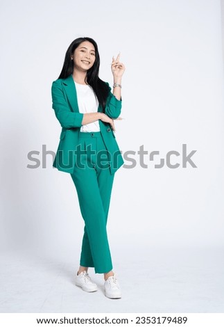 Portrait of young Asian business woman on white background Royalty-Free Stock Photo #2353179489