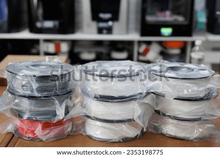 ABS or pla filament coils for 3d printer. New reels in the package Royalty-Free Stock Photo #2353198775