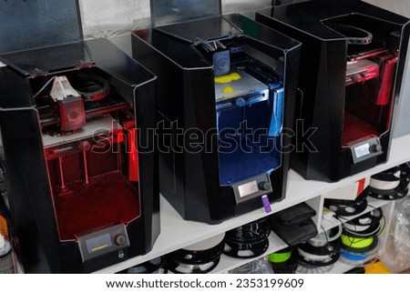 3D printing machine. Automatic three dimensional 3d printer performs product creation Royalty-Free Stock Photo #2353199609