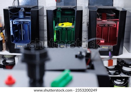 3D printing machine. Automatic three dimensional 3d printer performs product creation Royalty-Free Stock Photo #2353200249