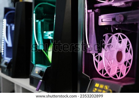 Personal 3d printer and abs or pla filament coils. 3d printing technology Royalty-Free Stock Photo #2353202899