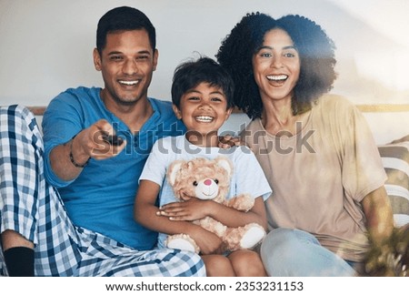 Happy, morning and a family watching tv on bed in their home together for streaming or entertainment. Parents, children or funny boy in the bedroom with his mom and dad to enjoy a television movie