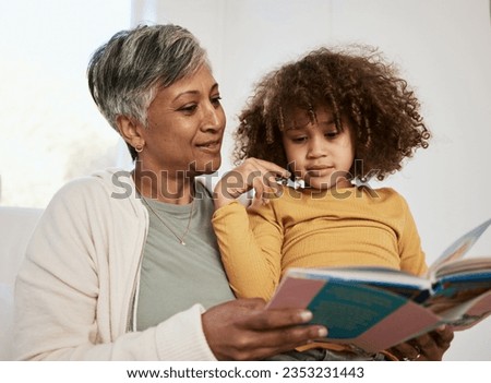 Home, grandmother and young child reading book, cartoon comic and bonding with senior woman in lounge. Learning, youth development education or grandma storytelling fairytale fantasy to listening kid