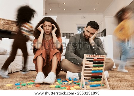 Parents, floor and stress with children running, toys or motion blur for speed, game or overwhelmed in home. Mother, dad and kids on carpet, living room and family house in chaos, anxiety or burnout Royalty-Free Stock Photo #2353231893