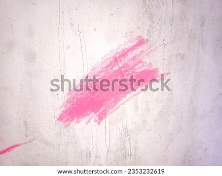 The graffiti on the pink wall forms a quite interesting work of art
