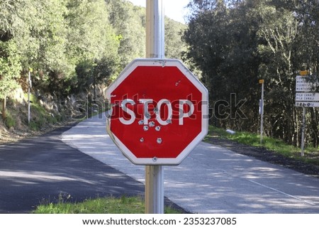 stop sign with bullet impact from Corsica