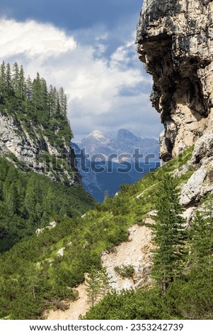 Valley Val Travenanzes and rock face in Tofane gruppe, Alps Dolomites mountains, Fanes national park, Italy Royalty-Free Stock Photo #2353242739