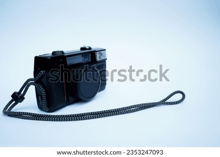 close up of a classic camera on a plain white background.