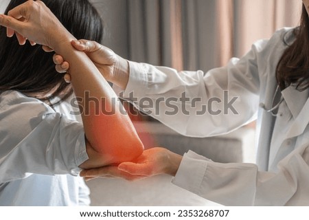 Rheumatism elbow pain, sore, cramp, numb, rheumatoid arthritis, osteoarthritis in woman patient having physical therapy consultation at orthopedic or physical therapist clinic 