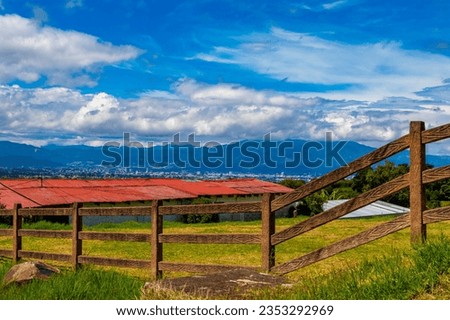 Beautiful mountain landscape and city panorama with forest trees clouds and nature of San José and Heredia in Costa Rica.