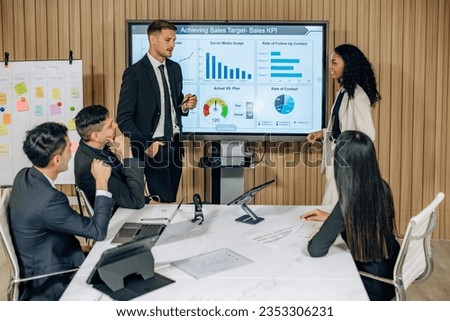 The multicultural business team engages in collaborative brainstorming sessions to develop cutting-edge strategies and new business model for achieving our sales key performance indicators (KPIs). Royalty-Free Stock Photo #2353306231