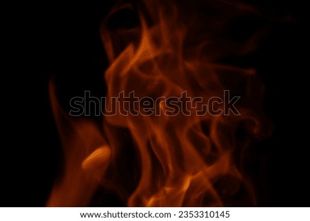 Fire flames background. Heat energy heap closely, red and yellow, thermal energy at the fuel point during the night on a black background