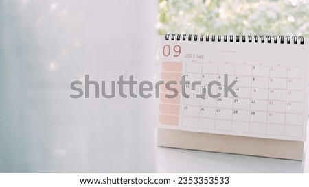 Desk September 2023 Calendar. 2023 September desk calendar or planner weeks on home window background. Start September planning