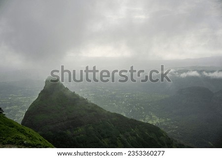 Lonavala, India August 27 2023 Beautiful misty lush green valleys and landscapes with fog, waterfalls  and lake in background at  Lonavala city in Maharashtra, India