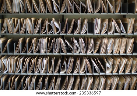 Shelf with file folders in a archives Royalty-Free Stock Photo #235336597