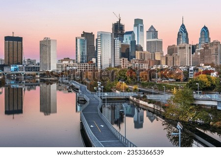 Philadelphia, Pennsylvania, USA downtown skyline on the Schuylkill River in autumn at dusk.