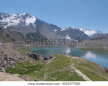 a picture of lulusar lake one of the beautiful and wonderful lake of world with beautiful mountains natural image no with no editing picture of mountains with lake and trees