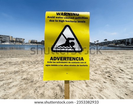 Warning avoid water contact activities due to high bacteria levels sign in the Marina Del Rey area of Los Angeles California.  