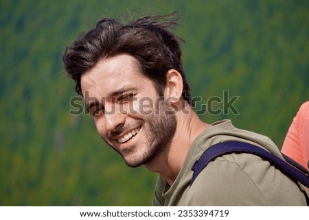                              The handsome man's face is a study in allure and confidence. His chiseled features are enhanced by his perfectly groomed black hair, adding an air of sophistication to his Royalty-Free Stock Photo #2353394719