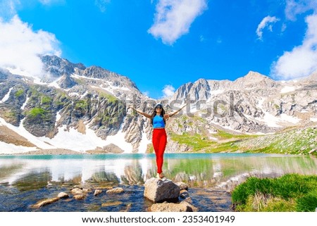 happy hiker picture with lake and mountain view
