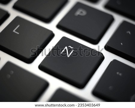 Black ñ eñe key closeup on a laptop keyboard 