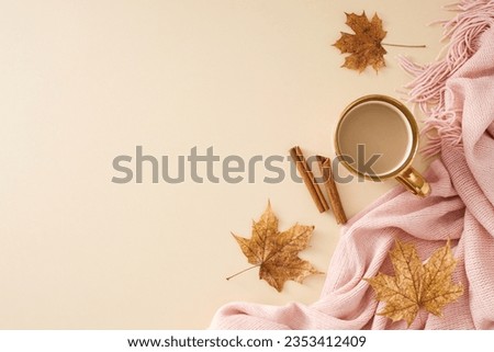 Wrap yourself in the cozy comfort of your home sanctuary. Top view photo of pink blanket, coffee mug, cinnamon sticks, acorn, fallen leaves on pastel beige background with promo spot