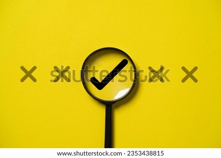 Correct sign mark inside magnifier glass among cross mark for focusing approve and reject business project proposal concept.