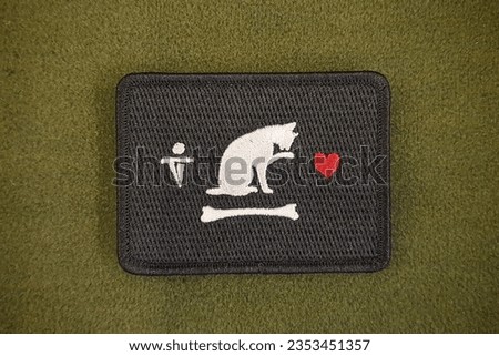 The cat emblem patch is velcro, used for attaching clothes and bags. Royalty-Free Stock Photo #2353451357