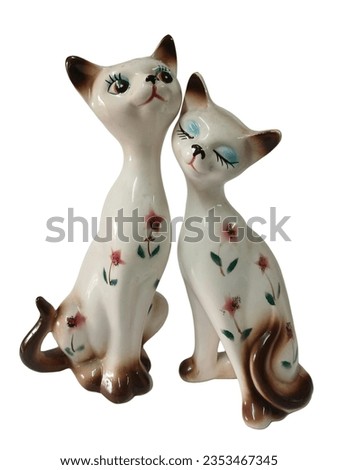 couple ceramic cats male and female snuggling together